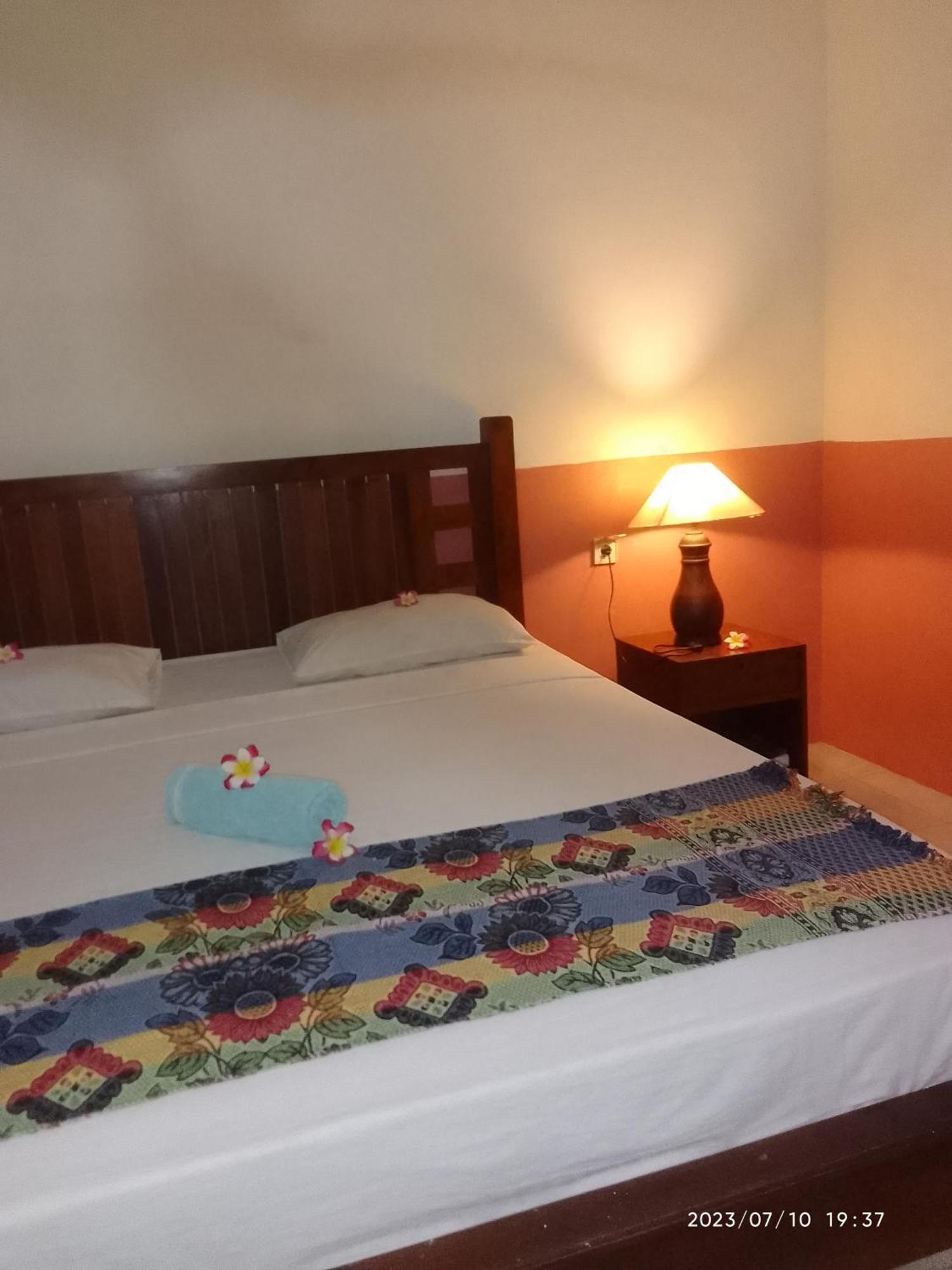 Kputra Homestay Amed Habitación foto